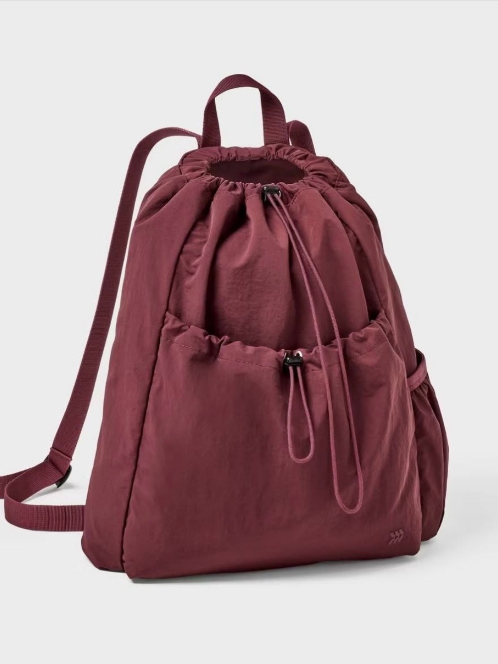 Burgundy all in motion water resistant pull string backpack.
New